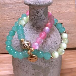 Pink and Green Stretch Bracelets 2 Pieces with Golden Sun Charms